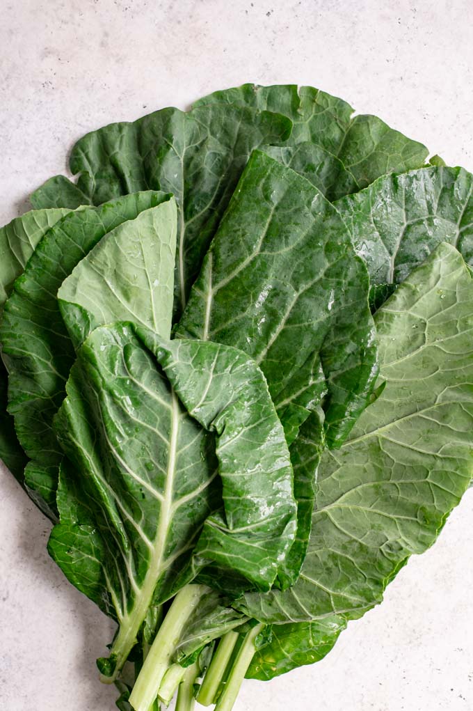 a bunch of collard greens on the table
