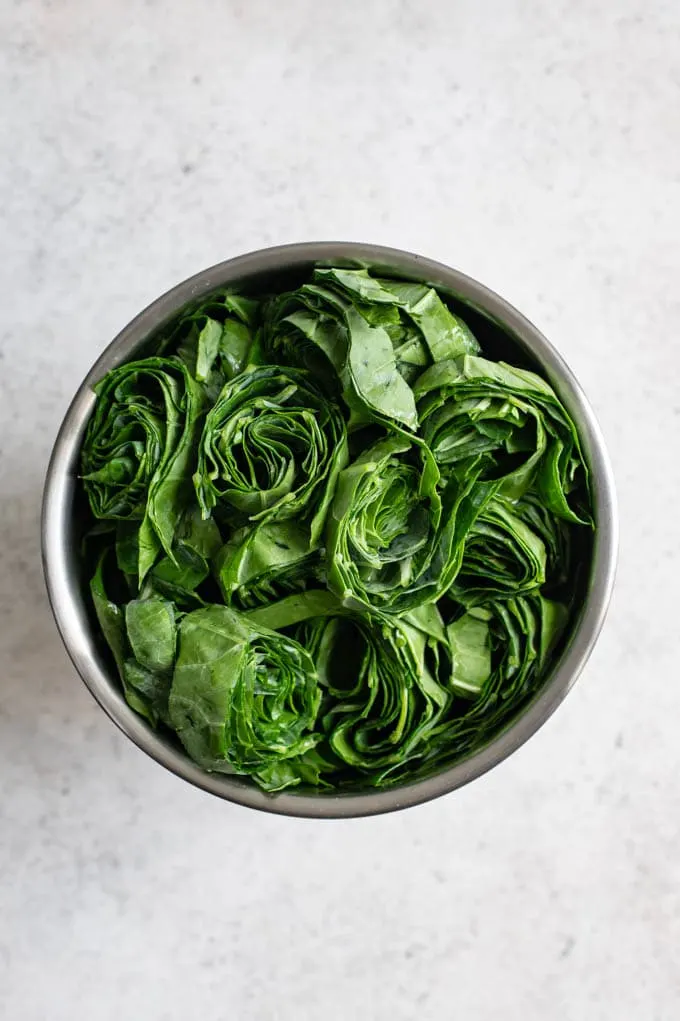 the ribboned collard greens, in a small mixing bowl before cooking