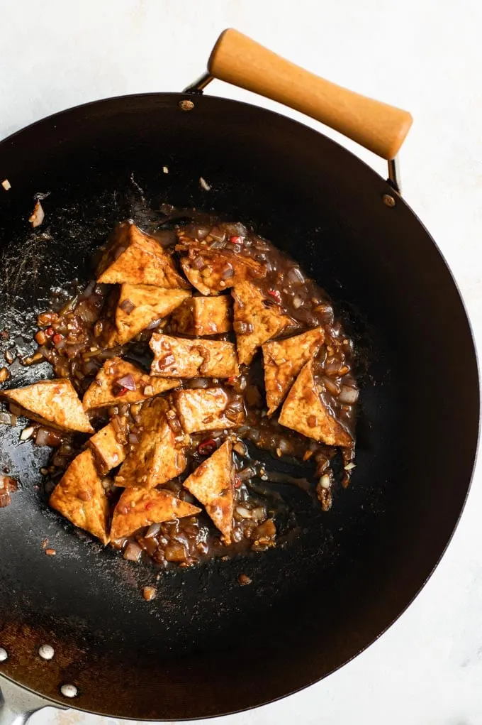 black bean sauce tofu cooking in a wok