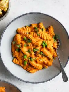 a close up of the curry mac and cheese served in a bowl