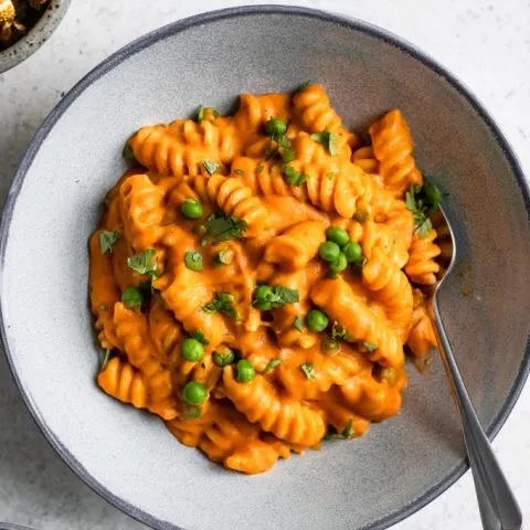 a close up of the curry mac and cheese served in a bowl