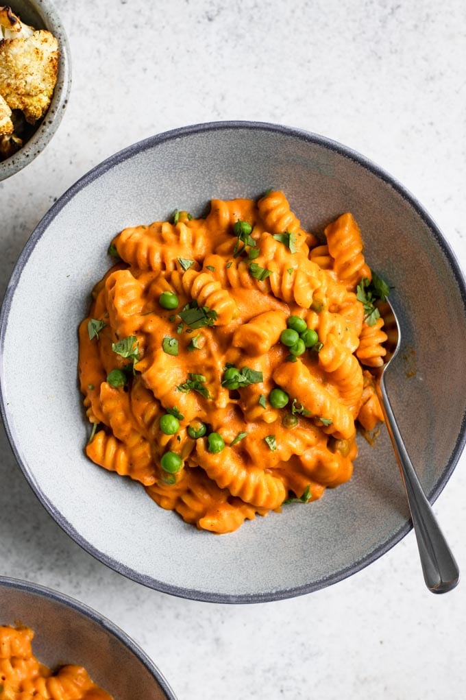 a close up of the curry mac and cheese served in a bowl