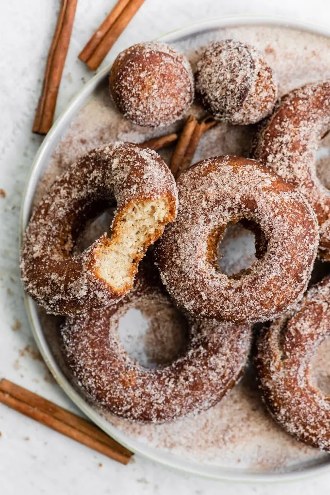 vegan cinnamon sugar apple cider donuts on a plate
