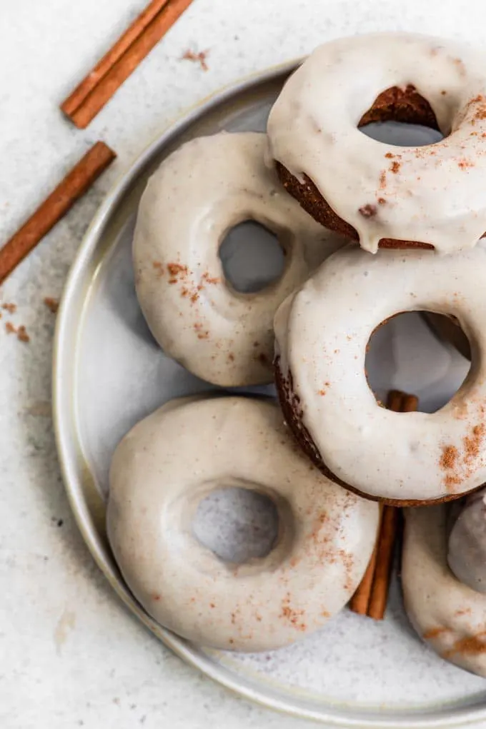 maple glazed apple cider donuts on a plate