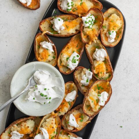 vegan baked potato skins served with sour cream