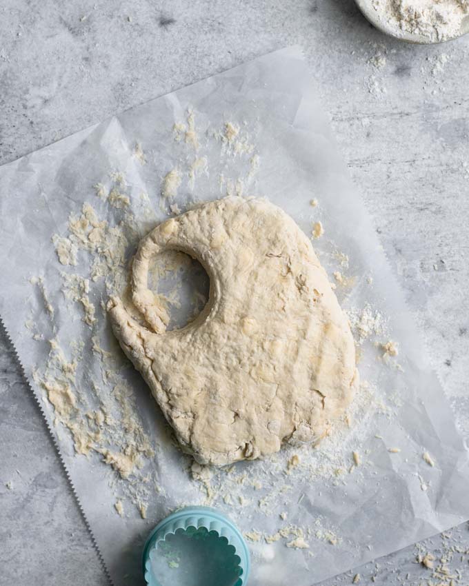 cutting the dough into biscuits