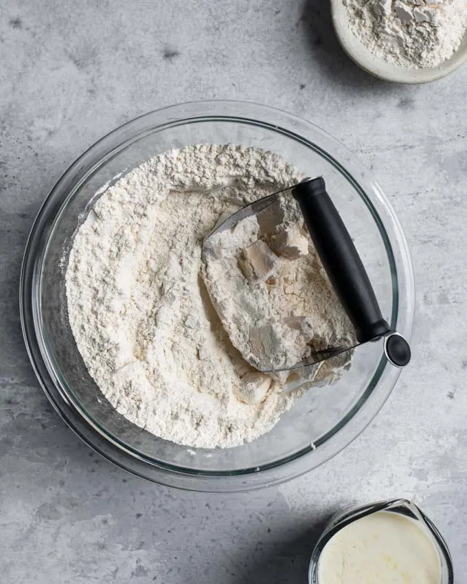 cutting the vegan butter into the dry mixture with a pastry blender