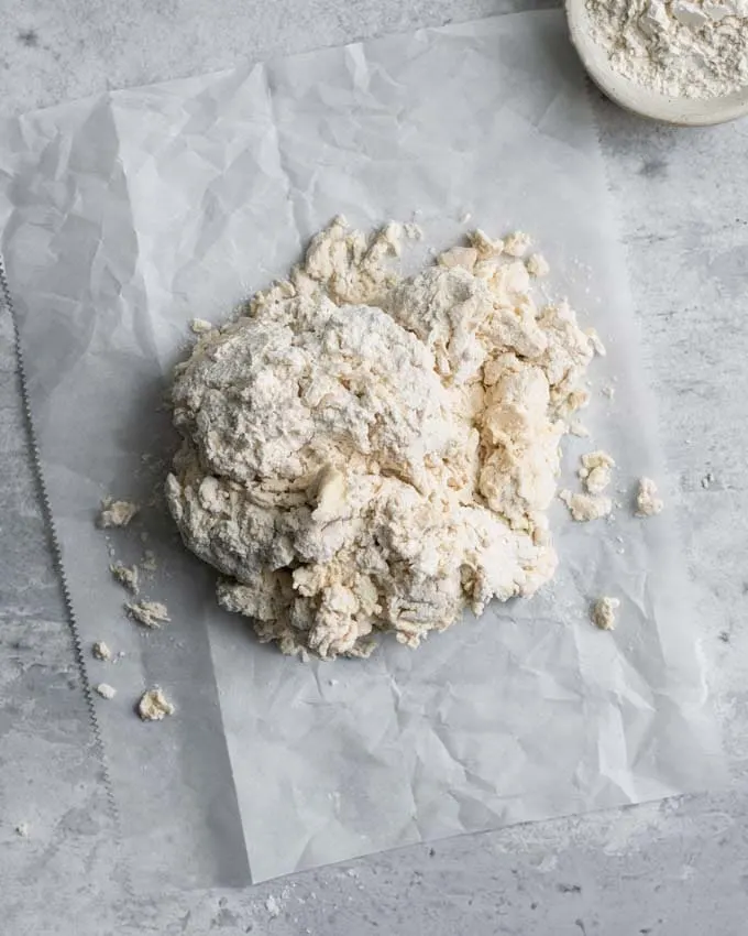 shaggy biscuit dough turned out onto counter