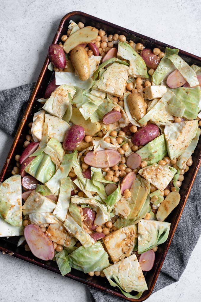 sheet pan veggies and chickpeas tossed in the mustard vinaigrette