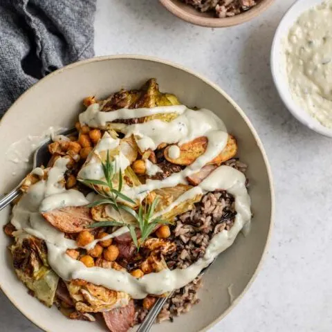 overhead view of the sheet pan dinner served in a bowl topped with gravy