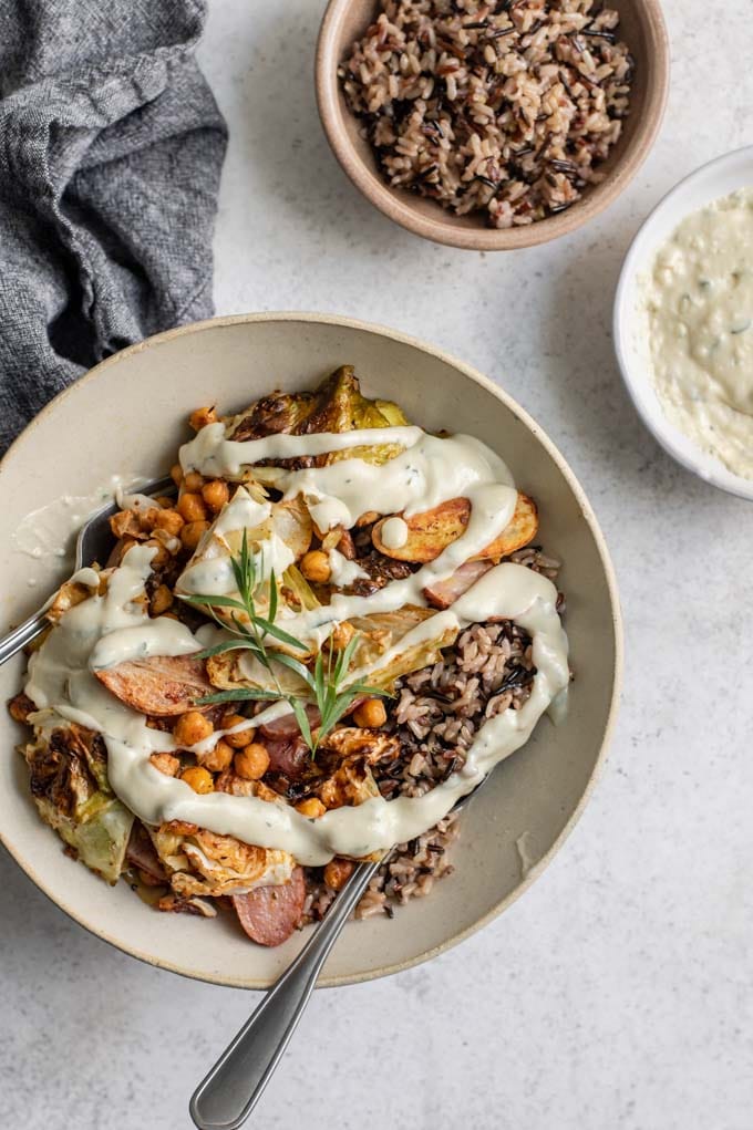 overhead view of the sheet pan dinner served in a bowl topped with gravy