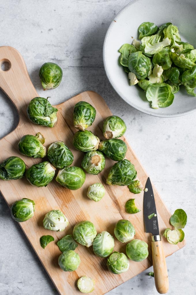 trimming brussels sprouts and removing damaged outer leaves