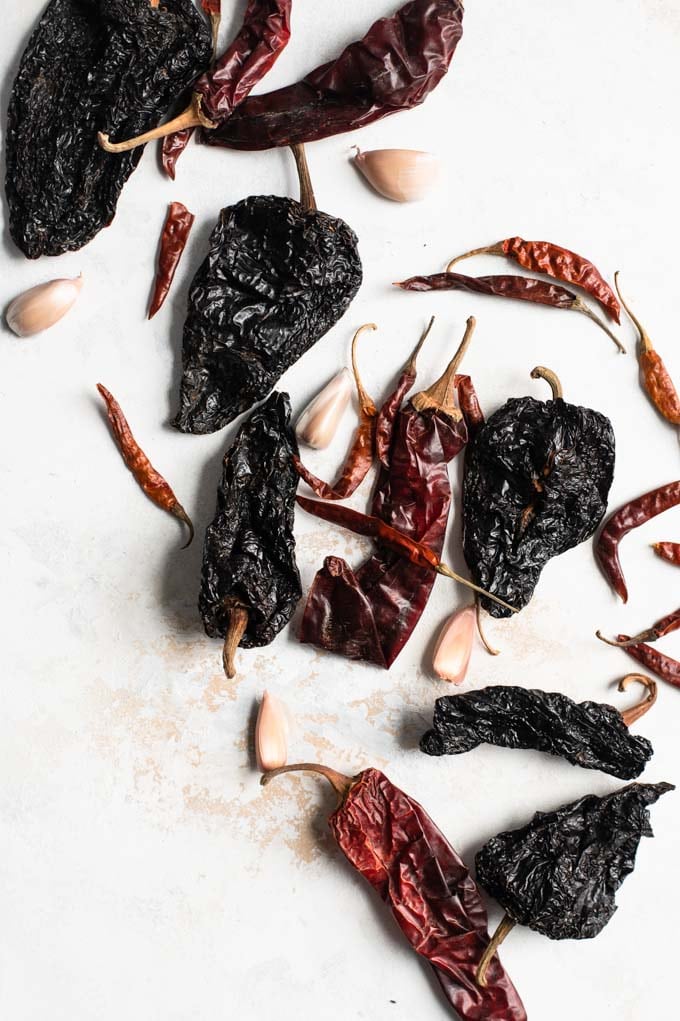 assortment of dried chiles and garlic cloves to make harissa