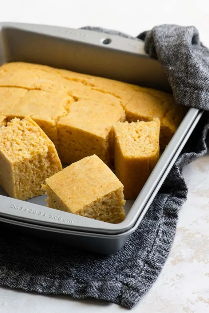 vegan cornbread cut in the baking dish