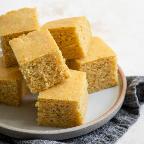 vegan cornbread stacked on a plate