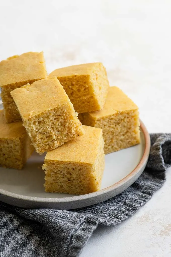 vegan cornbread stacked on a plate