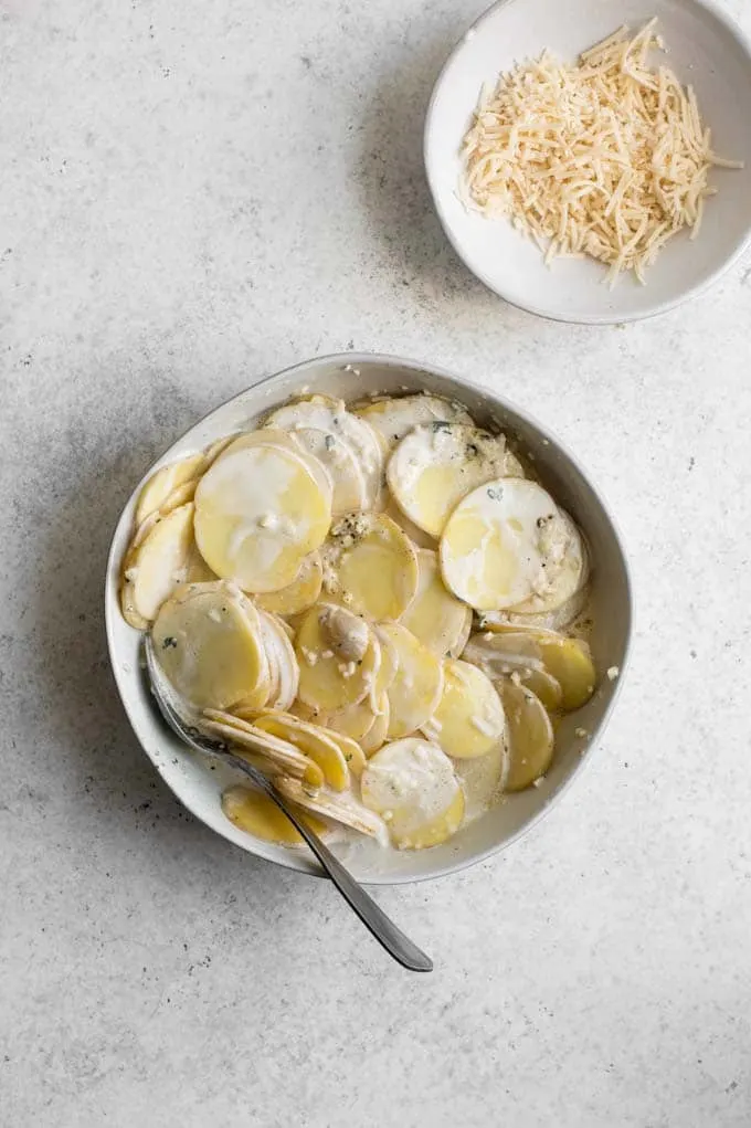 potatoes mixed with vegan cream, vegan parmesan, garlic, thyme, salt, and pepper