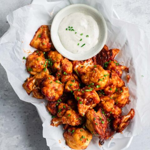 cranberry barbecue cauliflower wings served with vegan ranch