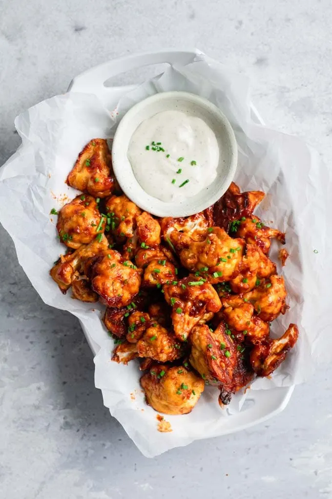 cranberry barbecue cauliflower wings served with vegan ranch
