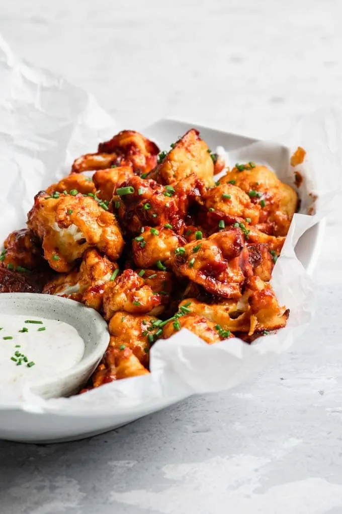 cranberry barbecue cauliflower wings served with vegan ranch