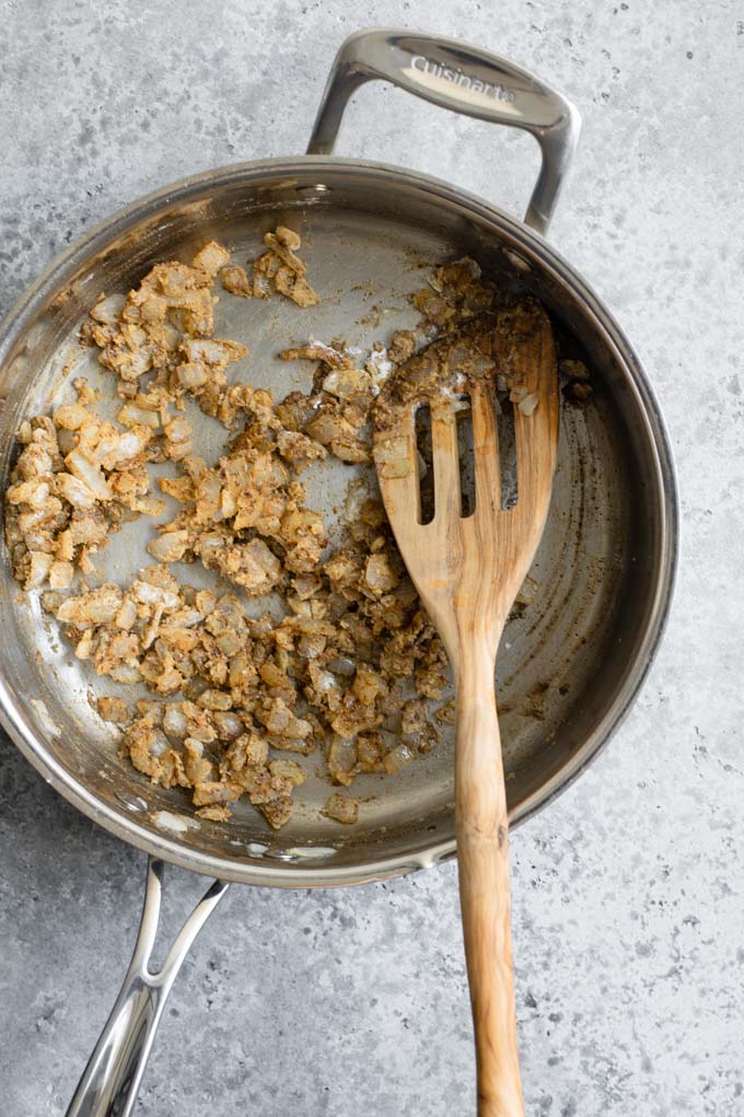 stir in flour to coat onion mixture in pan