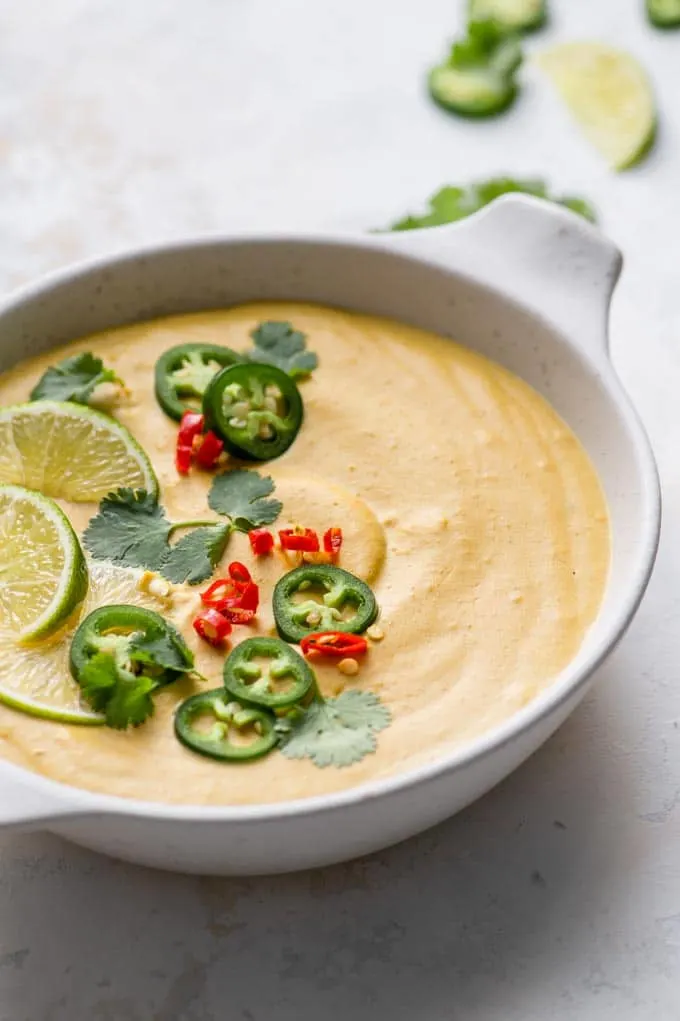 butternut queso served with chilies, lime, and cilantro