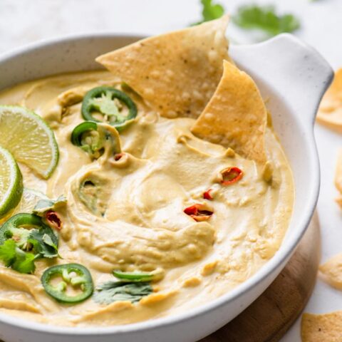 chips dipped into butternut queso