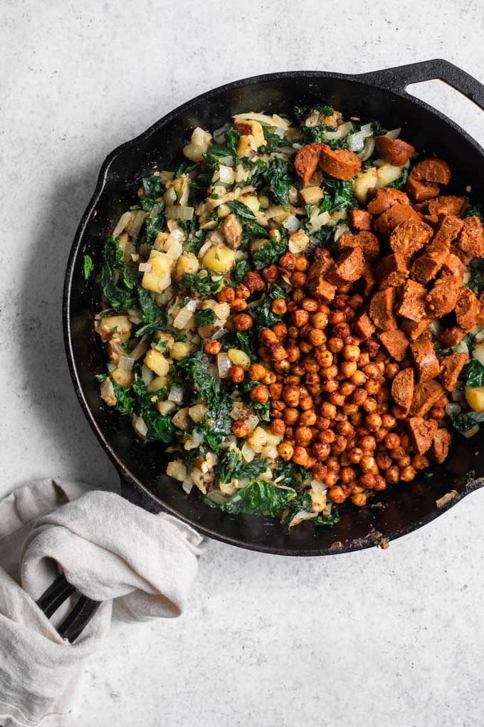 chorizo chickpeas and vegan sausage added to pan