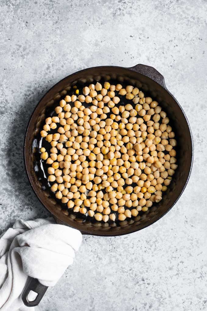 chickpeas pan fried in a skillet