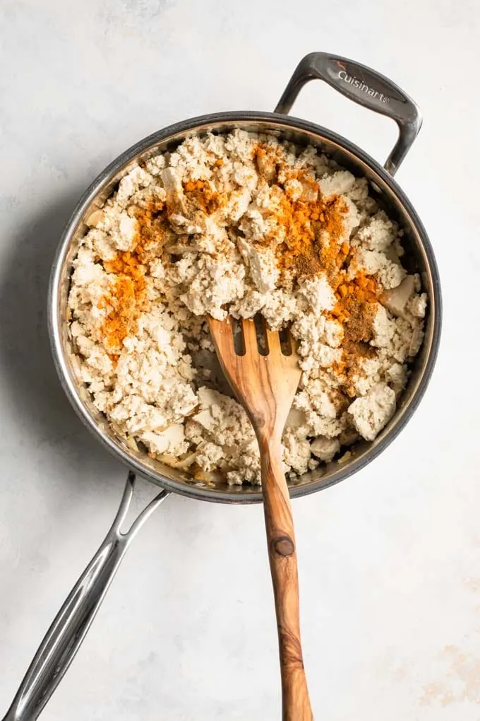 tofu and spices added to the fried aromatics in pot