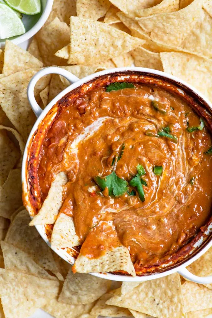 close up of refried bean dip with a sour cream swirl