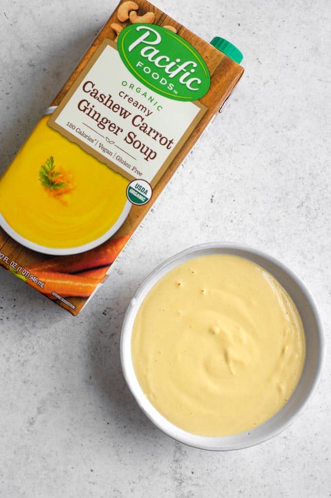 bowl of carrot dressing and box of soup used to make dressing