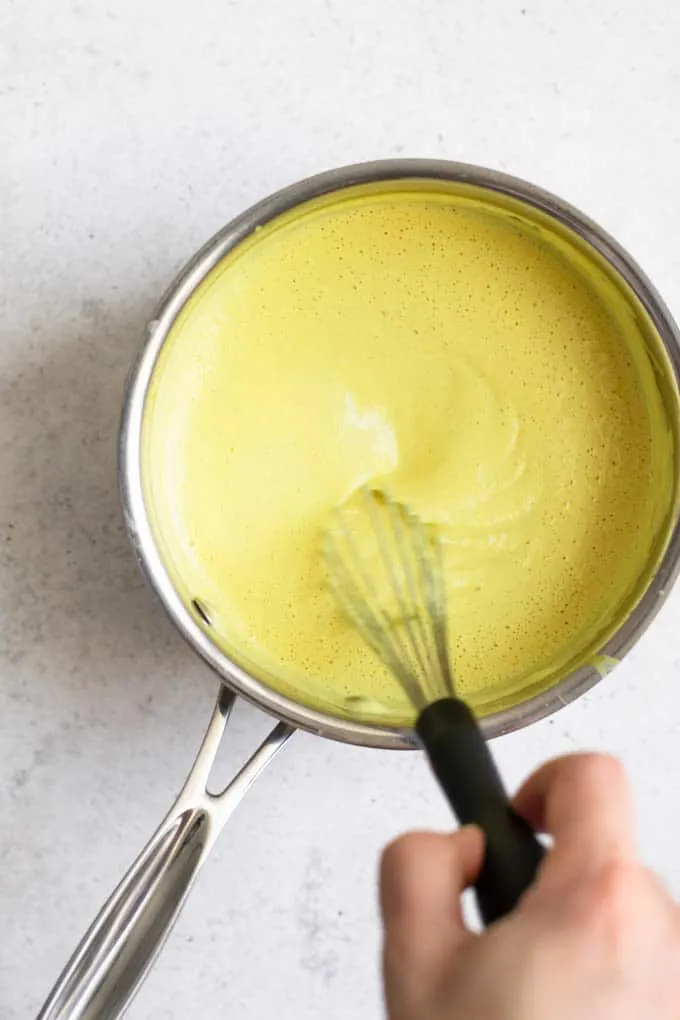 whisking vegan hollandaise in pot