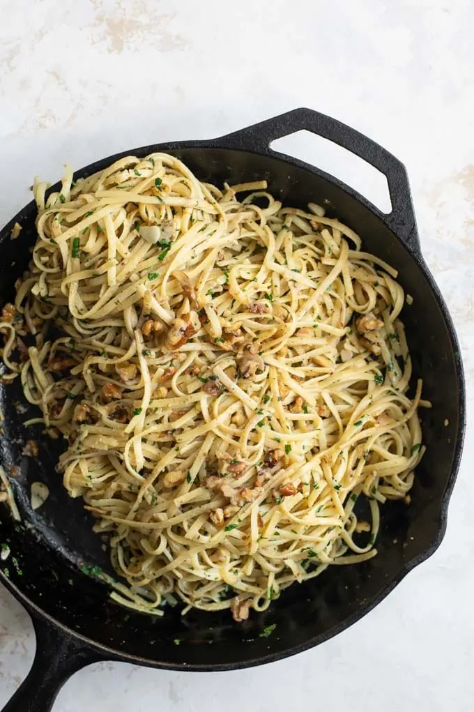 linguine tossed in the skillet with the walnut mixture