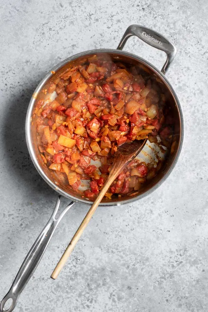 tomatoes cooked until soft and broken down in pot