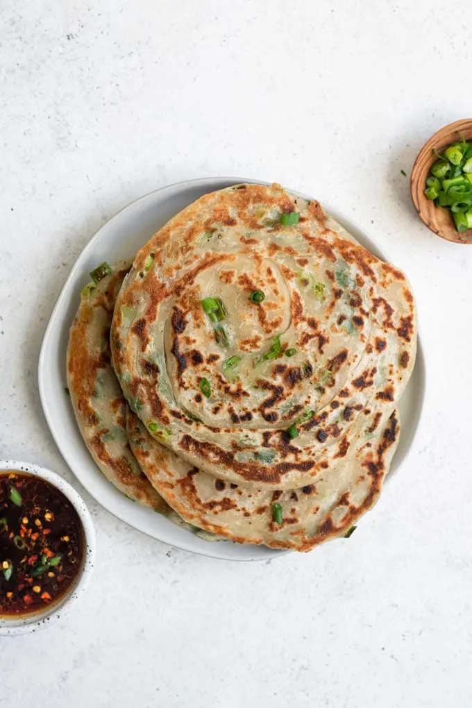 flaky scallion pancakes on a plate