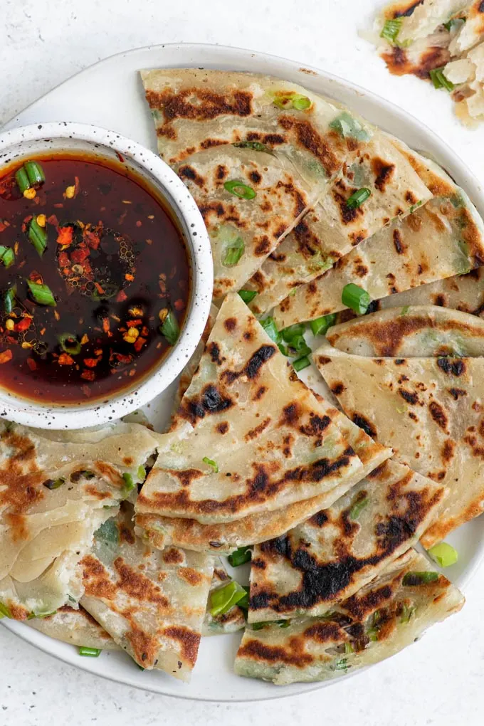 scallion pancakes cut into wedges and served with a soy dipping sauce