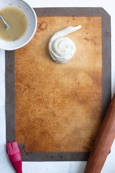 the scallion pancake dough rolled into a spiral with the final end left out