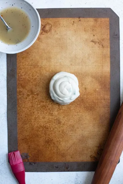 scallion pancake rolled into a spiral with end tucked under