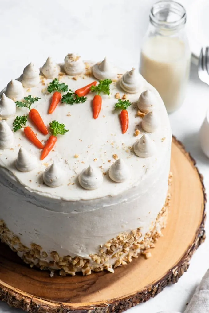 3 layer carrot cake with cream cheese frosting and marzipan carrot decorations