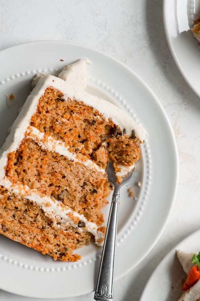 carrot cake slice with a bite on a fork