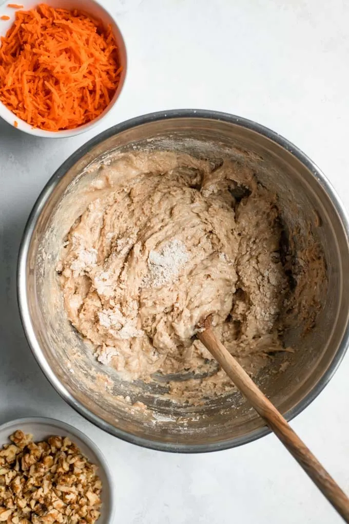 carrot cake batter mixed together to just mixed before adding carrots and walnuts
