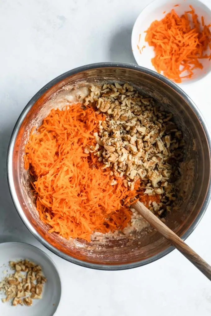 carrots and walnuts aded to carrot cake batter