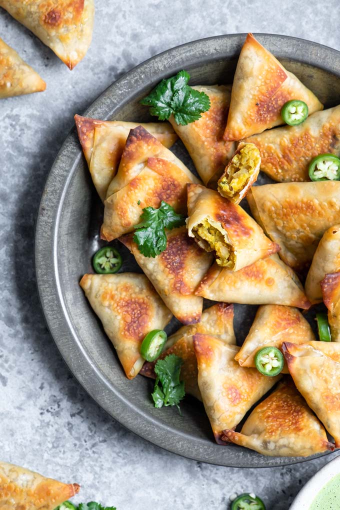 close up of baked samosa with one cut in half