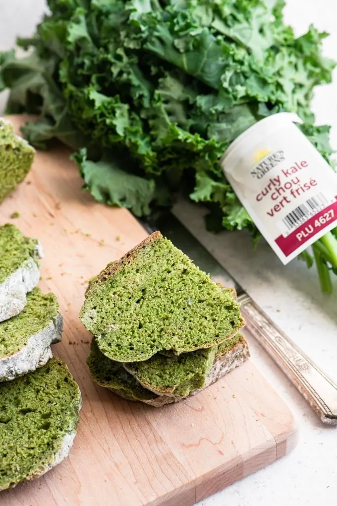 pieces of soda bread with a bunch of kale