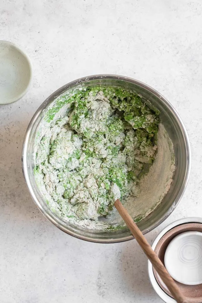 stirring in kale butter milk to dry ingredients