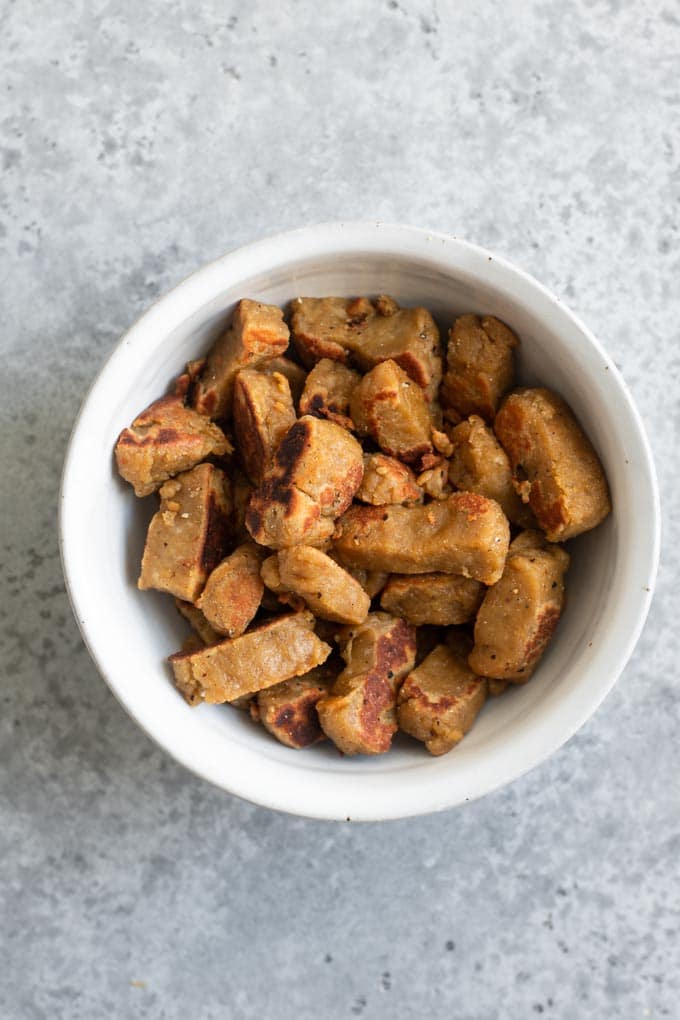 seitan dough chunks fried and set aside in bowl