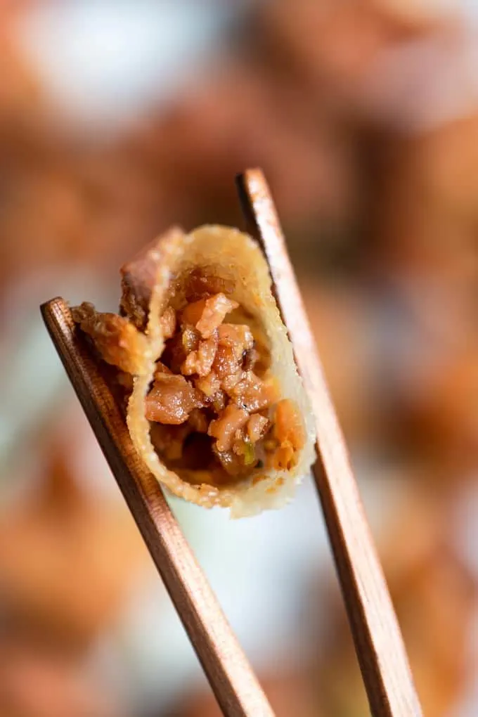 bite shot of vegan wontons, showing filling