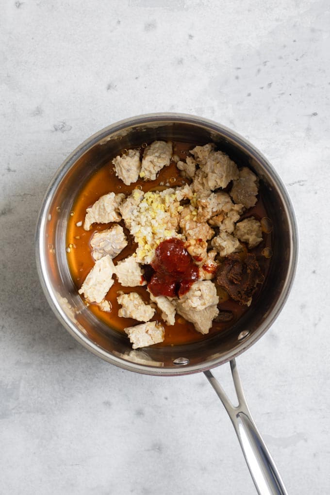 tempeh and ingredients in pot for steaming