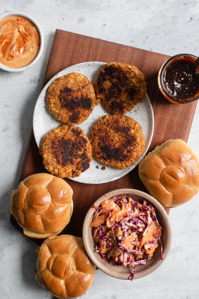 everything you need for korean bbq burgers: tempeh patties, kimchi slaw, korean BBQ sauce, and vegan buns